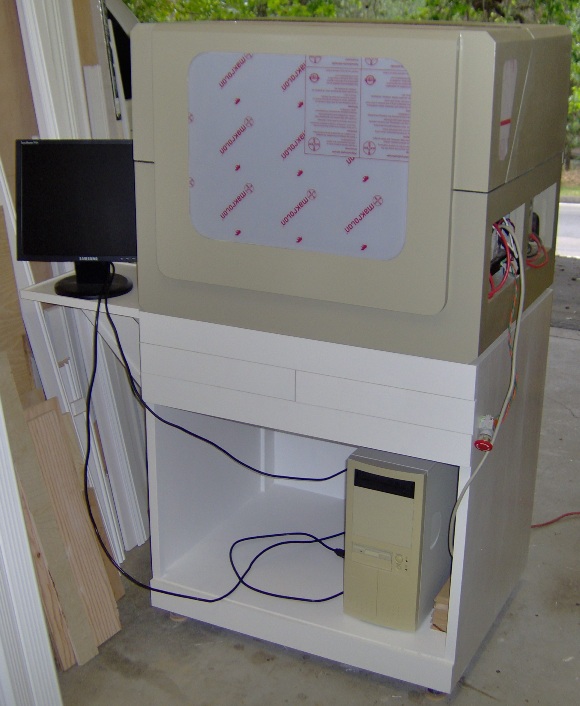 CNC machine on its cabinet